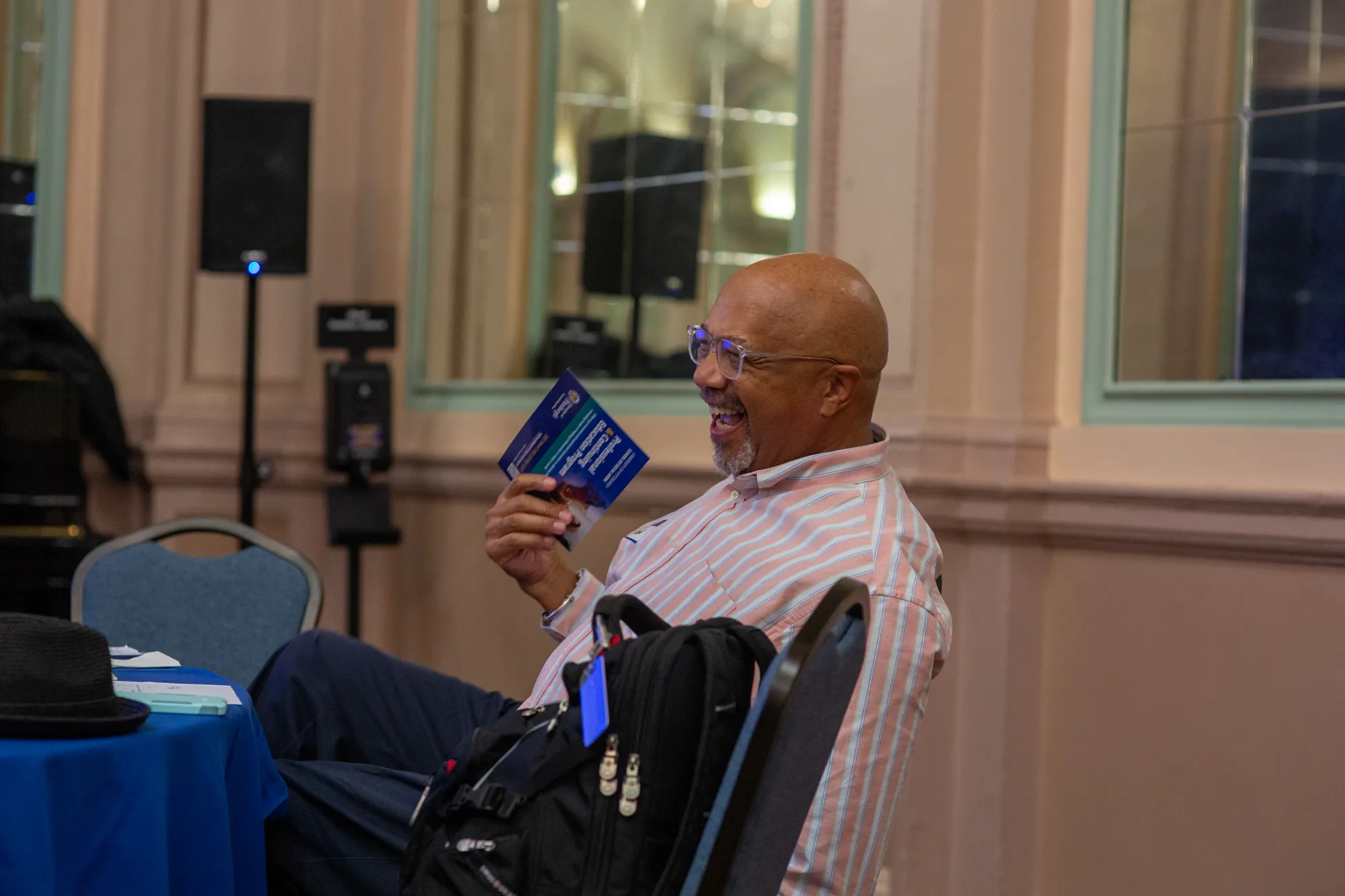 Community members in conversation during a public event.